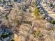 Aerial view of a luxurious neighborhood with lush green golf course, and stunning homes at 3690 Millwater Xing, Dacula, GA 30019
