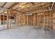 Unfinished basement features concrete floors, exposed ceilings, and wooden beams at 3690 Millwater Xing, Dacula, GA 30019