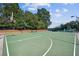 Well-maintained outdoor basketball court in a community park on a sunny day at 3690 Millwater Xing, Dacula, GA 30019
