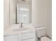 Bright bathroom with a white vanity, modern faucet, and white walls at 3690 Millwater Xing, Dacula, GA 30019