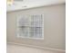 The bedroom has plush carpet, a window, and neutral paint at 3690 Millwater Xing, Dacula, GA 30019
