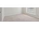 Empty bedroom with white walls and light-colored carpet and window at 3690 Millwater Xing, Dacula, GA 30019