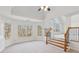 Bonus room with hardwood stairs, tray ceilings, and lots of natural light at 3690 Millwater Xing, Dacula, GA 30019