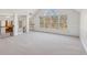 Bright upper bonus room with large windows, hardwood stairs, and plenty of natural light at 3690 Millwater Xing, Dacula, GA 30019