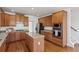 Well-appointed kitchen featuring a center island, stainless steel appliances, and hardwood floors at 3690 Millwater Xing, Dacula, GA 30019