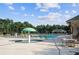 Resort-style pool and spa with umbrella fountains and lounge seating, perfect for relaxation at 3690 Millwater Xing, Dacula, GA 30019