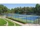 Professional-grade community tennis courts with manicured landscaping and viewing areas at 3690 Millwater Xing, Dacula, GA 30019
