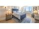 This cozy bedroom features a large window with city views and a stylish upholstered bed at 75 14Th Ne St # 3160, Atlanta, GA 30309