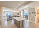Contemporary open-concept living space with a large island and city skyline view at 75 14Th Ne St # 3160, Atlanta, GA 30309