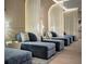 Spa relaxation room featuring luxurious velvet chaises, sheer curtains and soft lighting at 75 14Th Ne St # 3160, Atlanta, GA 30309