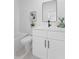 Modern bathroom with white vanity, a large framed mirror, and a shower-tub combination at 150 Chandler Trace, Covington, GA 30016