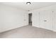 Spacious, bright bedroom with neutral carpet and closet doors at 150 Chandler Trace, Covington, GA 30016