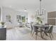 Bright living room with modern furniture, dining area, and abundant natural light at 150 Chandler Trace, Covington, GA 30016