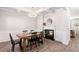 Dining room featuring a modern chandelier, fireplace, and plenty of seating at 4945 Bucknell Trce, Cumming, GA 30028