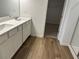 Bathroom featuring double vanity, hard surface flooring, and a separate walk-in shower at , Conyers, GA 30094