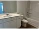 A clean bathroom with white vanity, ample mirror, and a shower-tub combination at , Conyers, GA 30094
