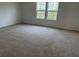 Spacious bedroom with neutral carpet and bright windows bringing in natural light at , Conyers, GA 30094