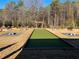 Enjoy this bocce ball court with arbor, benches, and landscaped area nestled in mature trees at , Conyers, GA 30094