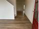 Bright foyer featuring wood-look flooring and a view of the staircase and other rooms at , Conyers, GA 30094