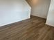 Hallway with wood-look flooring, flowing towards an open space and stairs at , Conyers, GA 30094