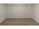 Walk-in closet with wire shelving and neutral carpet, offering ample storage at , Conyers, GA 30094