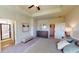 Bedroom featuring ensuite bathroom, walk in closet, neutral decor, ceiling fan and carpet at 110 Asher Dr, Carrollton, GA 30116