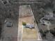 Aerial view showing property lines, tennis court, and surrounding neighborhood at 1560 Sever Rd, Lawrenceville, GA 30043