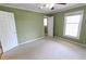 A cozy bedroom with carpet, ceiling fan, and natural light from the window at 1560 Sever Rd, Lawrenceville, GA 30043