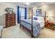 Comfortable bedroom featuring a four-poster bed, wood dresser, and bedside table with classic decor at 300 Johnson Ferry Ne Rd # A712, Atlanta, GA 30328