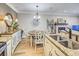 The kitchen and dining area showcase granite countertops and modern appliances at 300 Johnson Ferry Ne Rd # A712, Atlanta, GA 30328