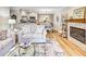 Open living area with a fireplace and dining space creating a warm, inviting atmosphere for relaxing at 300 Johnson Ferry Ne Rd # A712, Atlanta, GA 30328