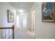 Bright hallway featuring decorative artwork and doors to rooms at 4650 Sharon Valley Ct, Atlanta, GA 30360