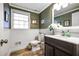 Tastefully updated powder room with modern fixtures, wainscoting, and stylish vanity at 4650 Sharon Valley Ct, Atlanta, GA 30360