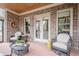 Cozy brick covered patio with comfortable seating and brick accents at 4880 Cecilia Sq, Cumming, GA 30040