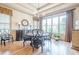 Formal dining room with hardwood floors, chandelier, and large windows with lots of natural light at 4880 Cecilia Sq, Cumming, GA 30040