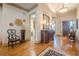 Inviting foyer with hardwood floors, elegant décor, and a view of the staircase and other rooms at 4880 Cecilia Sq, Cumming, GA 30040