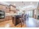 Spacious kitchen featuring stainless steel appliances, a large island, and adjacent dining area at 4880 Cecilia Sq, Cumming, GA 30040