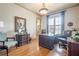 Elegant home office with hardwood floors, a large desk, and plenty of natural light at 4880 Cecilia Sq, Cumming, GA 30040