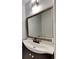 Bathroom features a sink with a decorative mirror and lighting at 3075 Elizabeth Ln, Snellville, GA 30078