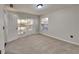 Bedroom featuring plush carpet flooring, closet with bifold doors, neutral walls, and natural light at 3075 Elizabeth Ln, Snellville, GA 30078