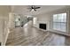 Spacious living room features a fireplace, vinyl plank floors and staircase at 3075 Elizabeth Ln, Snellville, GA 30078