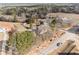 A high angle shot showcasing the property's mature trees, a horse paddock, and expansive green spaces at 4951 Center Hill Church Rd, Loganville, GA 30052