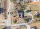 An aerial view of the property showcasing the house with driveway, a large yard, and nearby roads at 4951 Center Hill Church Rd, Loganville, GA 30052