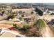 A neighborhood aerial view, showcasing spacious lots, mature trees, and a mix of residential properties at 4951 Center Hill Church Rd, Loganville, GA 30052