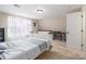Spacious bedroom featuring natural light from the window and room for a work or study area at 4951 Center Hill Church Rd, Loganville, GA 30052