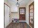 Welcoming entryway with dark vinly floors, and ample storage, blending style and functionality at 4951 Center Hill Church Rd, Loganville, GA 30052
