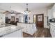 Bright kitchen featuring white cabinets, granite countertops, and stainless steel appliances at 4951 Center Hill Church Rd, Loganville, GA 30052