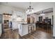 Bright kitchen featuring white cabinets, a kitchen island and stainless steel appliances at 4951 Center Hill Church Rd, Loganville, GA 30052