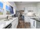 Bright kitchen featuring white cabinets, granite countertops, and stainless steel appliances at 4951 Center Hill Church Rd, Loganville, GA 30052