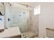 Bathroom featuring a marble-tiled shower with a glass door and new fixtures at 1114 Oak Knoll Se Ter, Atlanta, GA 30315